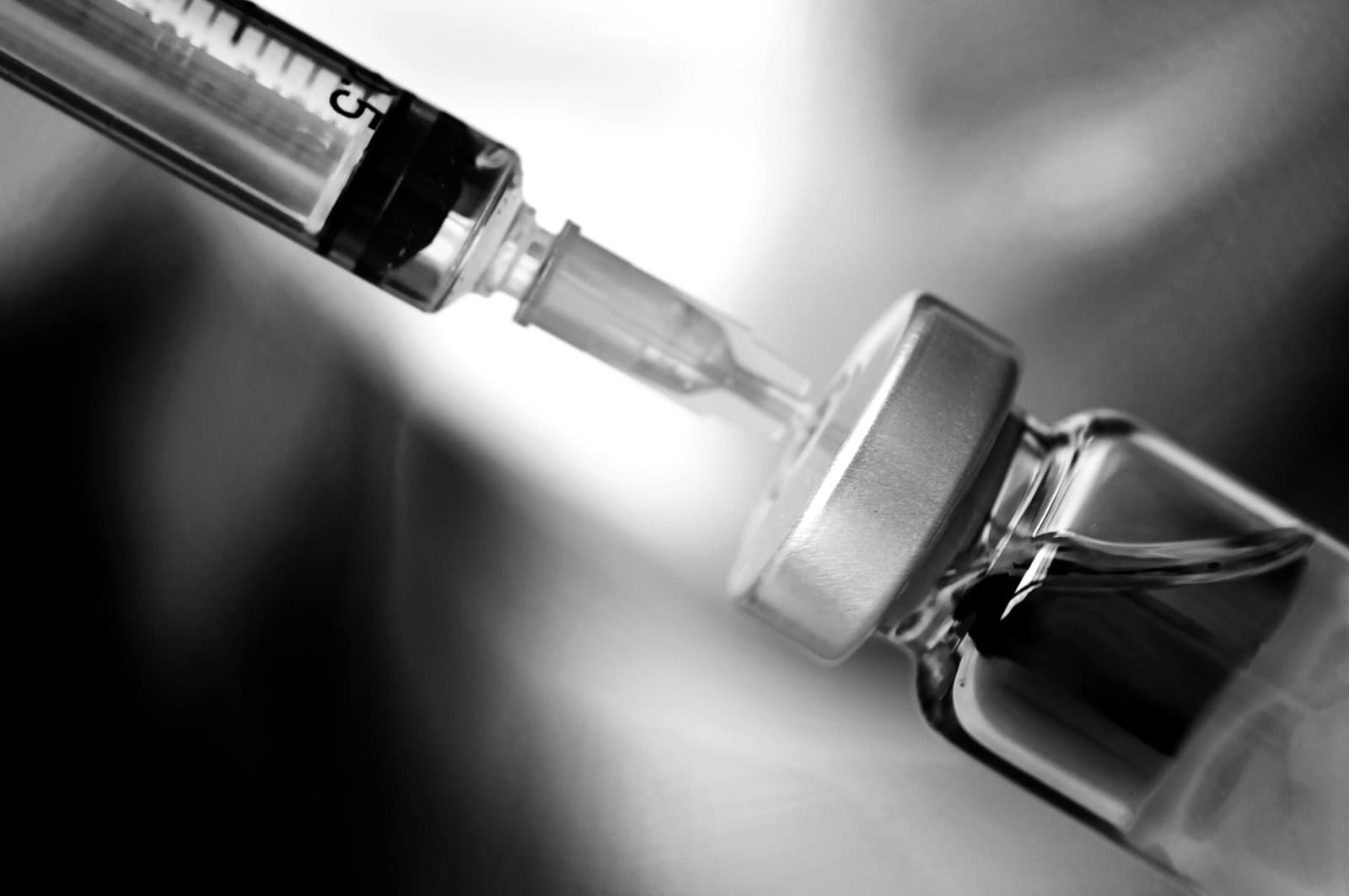 bottle and syringe - pharmaceutical concept