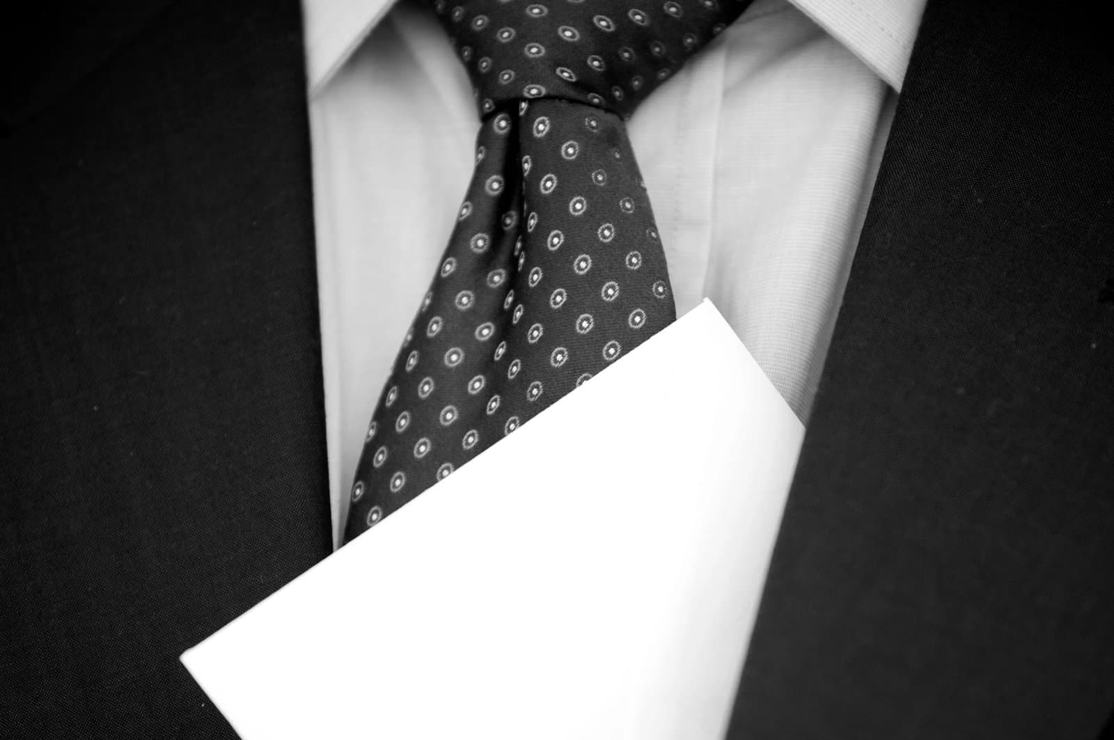 Man in a Suite hides an envelope with money