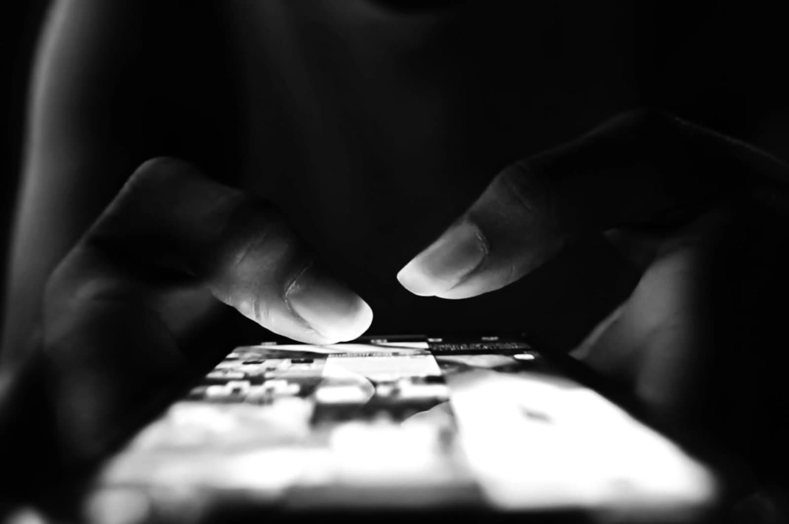 Close up of hands interacting with a smartphone screen