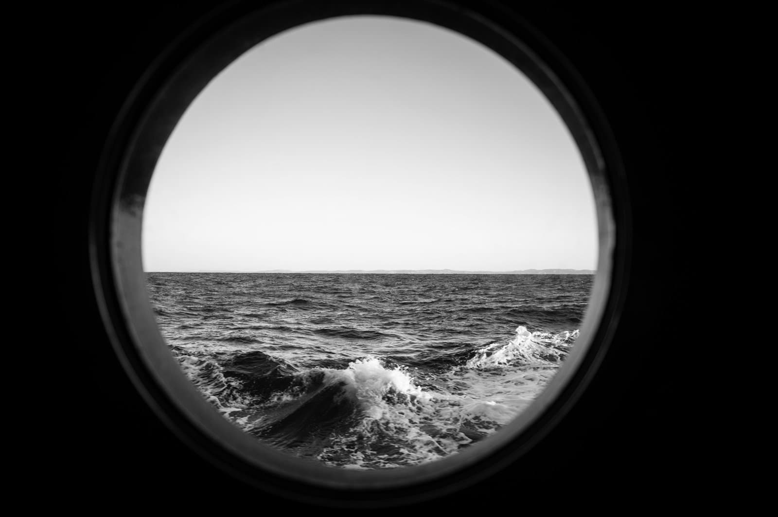 View on a rough sea, with waves of the open ocean from a boat.